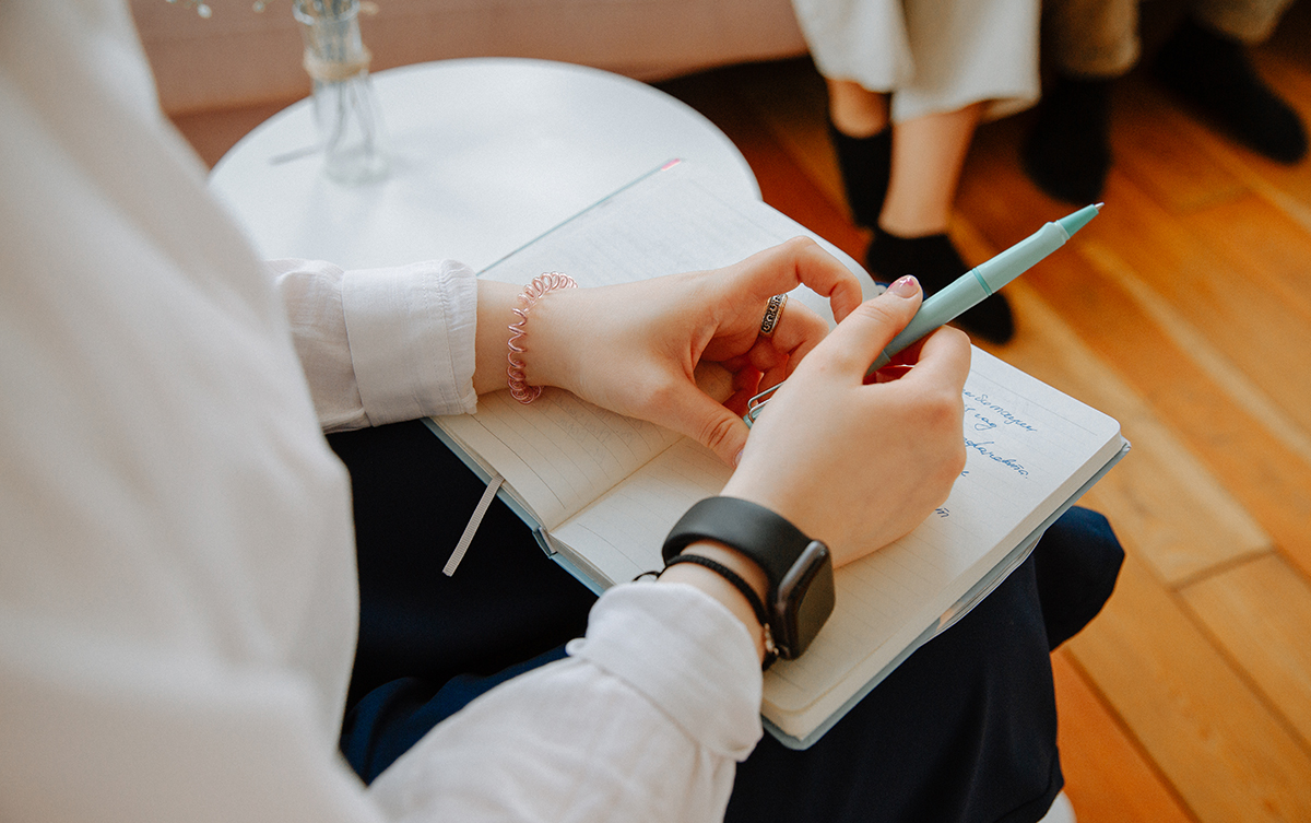 Counselor with pen and notebook