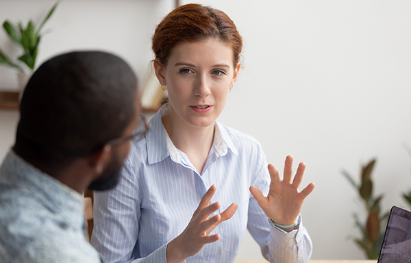 Young woman giving advice to a young man