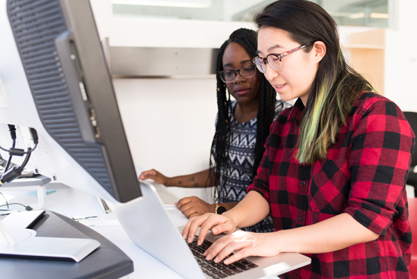 IT consultant helping co-worker with computer issue