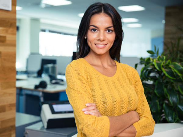 women standing at desk in courtroom