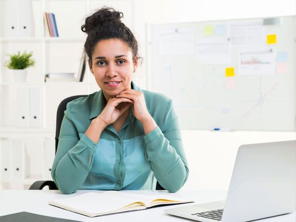 women with calendar and planner at a desk